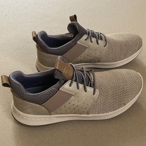 Skechers Tan Excellent condition shoes. Size 10-Slip on’s. Hardly worn.
